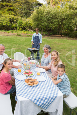 Cheerful extended family having a barbecue