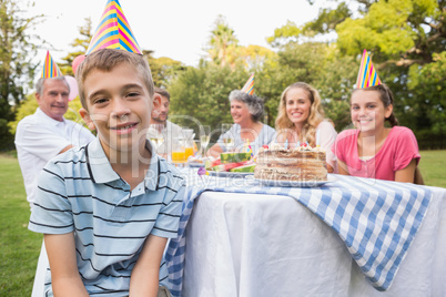 Little boy smiling at camera at his birthday party