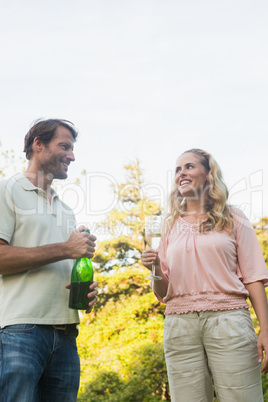 Beautiful couple having champagne together