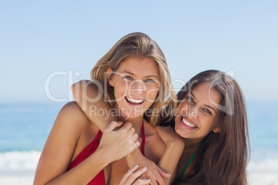 Two smiling friends posing together