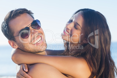 Cheerful loving couple hugging each other