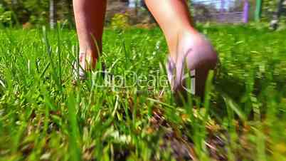girl running on green grass