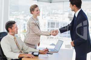 Business people shaking hands with their future patner