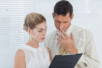 Concentrated coworkers analyzing documents together