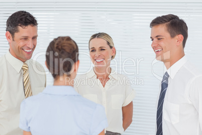 Smiling coworkers having a break together