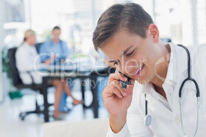 Young doctor having a phone call