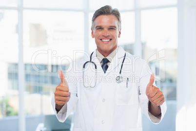 Experienced doctor posing thumbs up