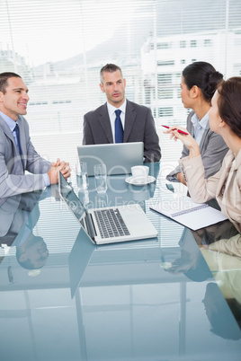 Concentrated business people working together over coffee