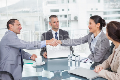 Smiling business people shaking hands