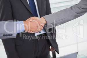 Close up on business people shaking hands