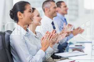 Cheerful employees applausing for presentation
