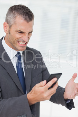 Businessman getting angry after a phone call