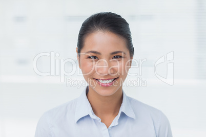 Happy businesswoman posing looking at camera