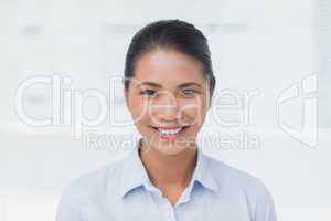 Happy businesswoman posing looking at camera