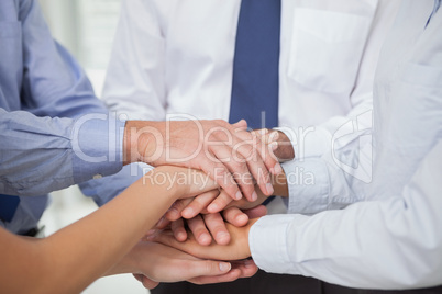 Close up on colleagues hands all together