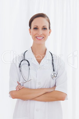 Smiling nurse with arms crossed looking at camera