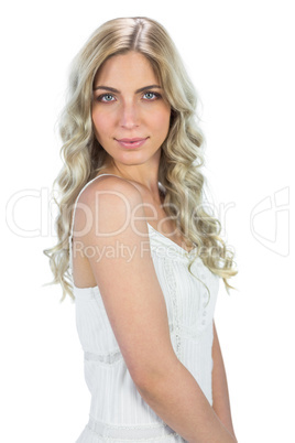 Relaxed attractive model in white dress posing