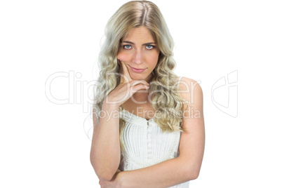 Unhappy seductive model in white dress