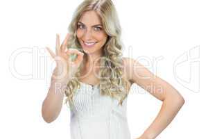 Positive seductive model in white dress waving