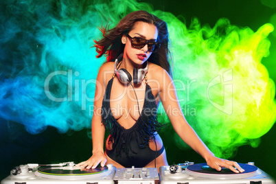 beautiful dj girl on decks on the party,