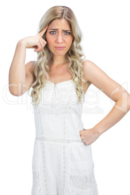 Curly haired blonde making crazy gesture