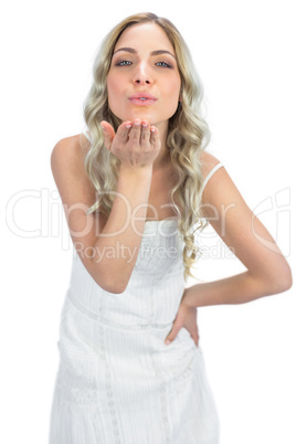 Cheerful  blonde sending a kiss to camera