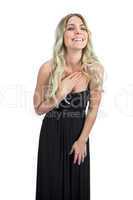 Attractive blonde with black cocktail dress laughing