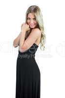 Attractive blonde wearing black dress posing