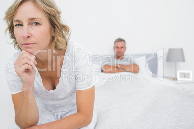 Angry woman looking at camera after fight with husband