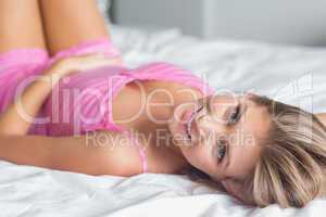 Sultry blonde lying on her bed