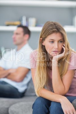 Couple not speaking after a fight on the sofa