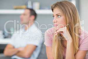 Couple not talking after a dispute on the couch