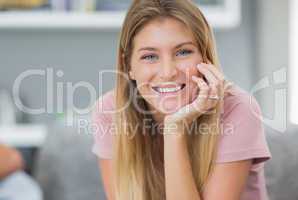 Smiling woman sitting on couch