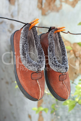 slippers hanging on a wire