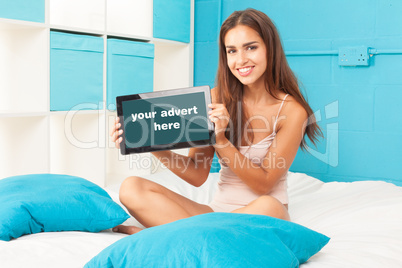 brunette woman on her bed