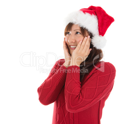 Daydreaming Asian Christmas woman