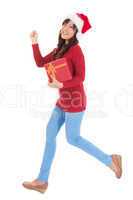 Christmas woman running with gift