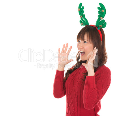 Happy Asian Santa woman shouting