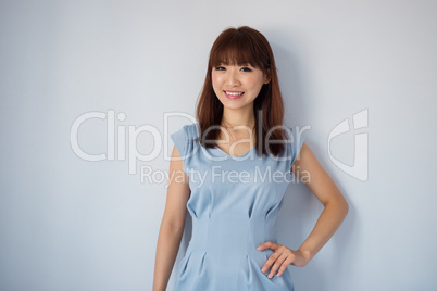 Cute Asian woman isolated on blue background.