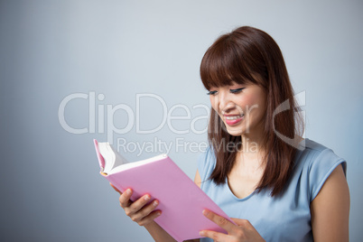 Asian woman reading a book