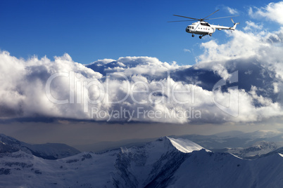 helicopter in winter mountains