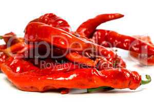 red chili peppers with water drops on white background