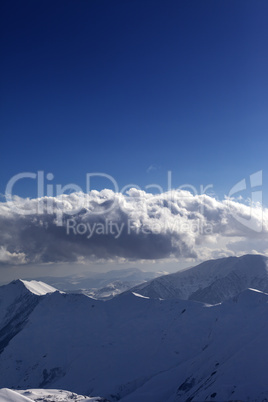 snow mountains and blue sky. view from ski slope.