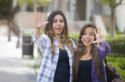 Mixed Race Female Students Waving Carrying Backpacks on School C