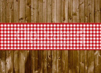 Braune Bretter-Holzwand mit rot-weißem Streifen