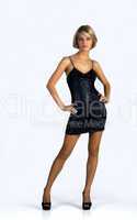 young woman in a black dress posing
