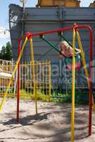 girl swinging on a swing