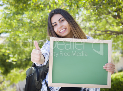 Excited Mixed Race Female Student Holding Blank Chalkboard