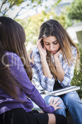 Stressed Sad Young Mixed Race Girl Being Comforted By Friend