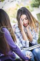 Stressed Sad Young Mixed Race Girl Being Comforted By Friend